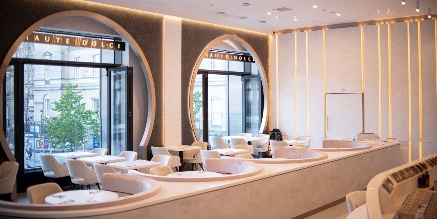 Haute Dolci Edinburgh: ivory booths curving beneath tall round-arched windows